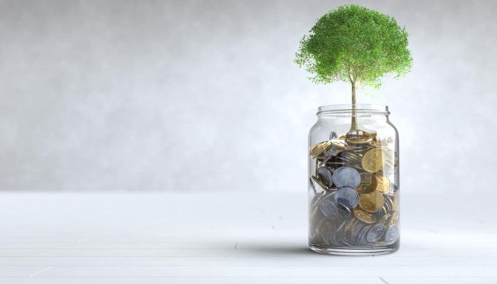 tree-grows-coin-glass-jar-with-copy-space